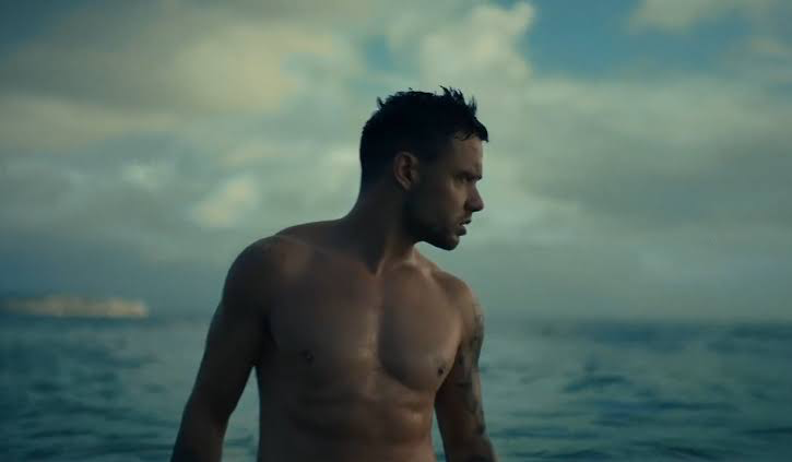 Liam Payne in his Live Forever music video with the sea behind him