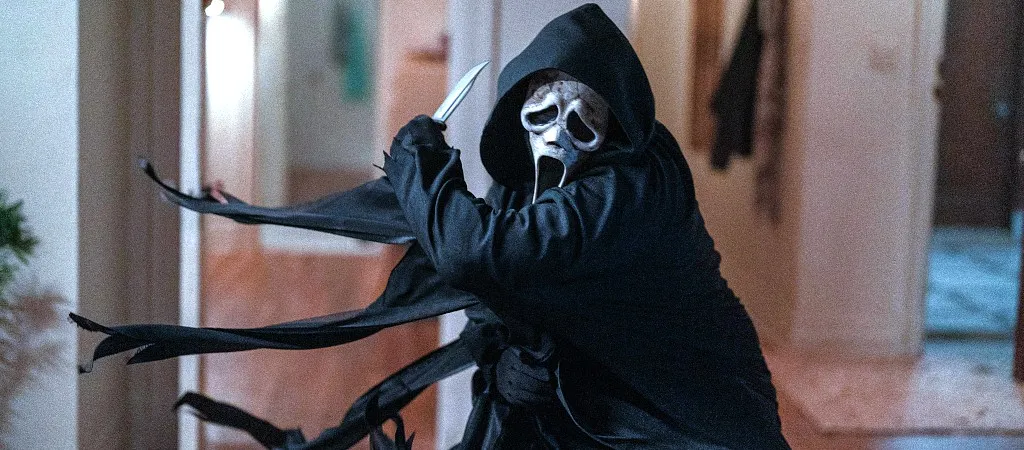 Ghostface, the masked antagonist from Scream VI, ready to strike with a knife