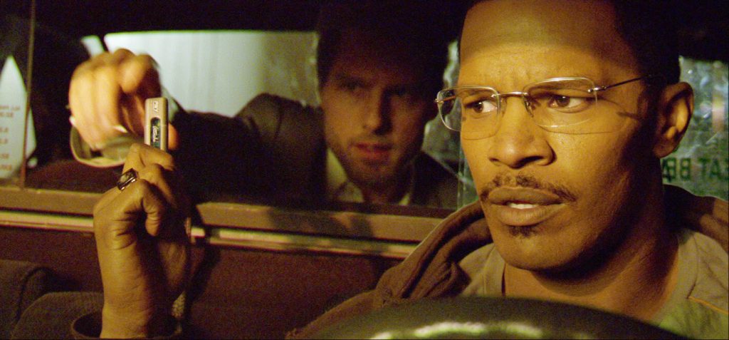 Tom Cruise as Vincent (a hitman) and Jamie Foxx as Max (a cab driver) star in Collateral.