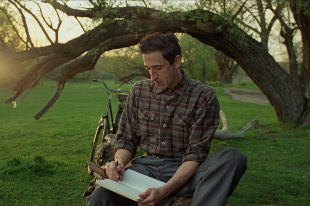 Adrien Brody as László Tóth, a Hungarian-Jewish Holocaust survivor who emigrates to America after World War II, in The Brutalist