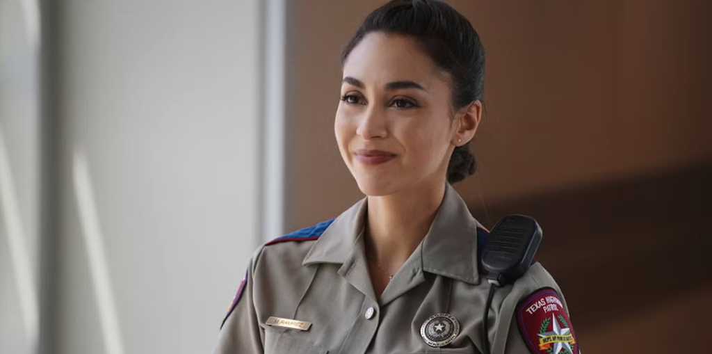 Lindsey Morgan smiles in a still from the show