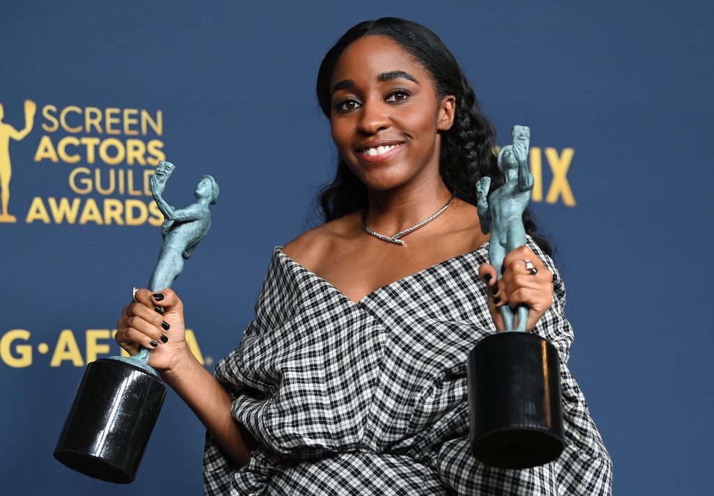 Ayo Edebiri holding two awards for her role as Sydney Adamu in 'The Bear' at the 30th Screen Actors Guild (SAG) Awards