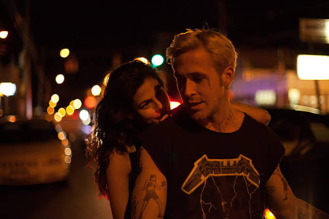 Ryan Gosling as a motorcycle stunt rider Luke, with Eva Mendes’ Romina in The Place Beyond the Pines