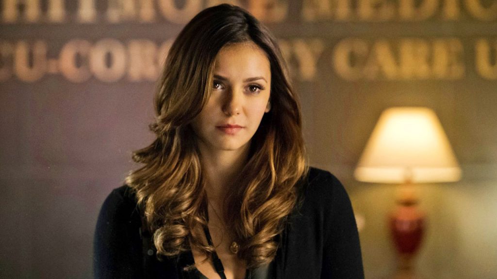 Glen Powell and Gigi Paris’ Relationship History: Who Did They Date Before Meeting Each Other? 2 Nina Dobrev in a smug smile from The Vampire Diaries