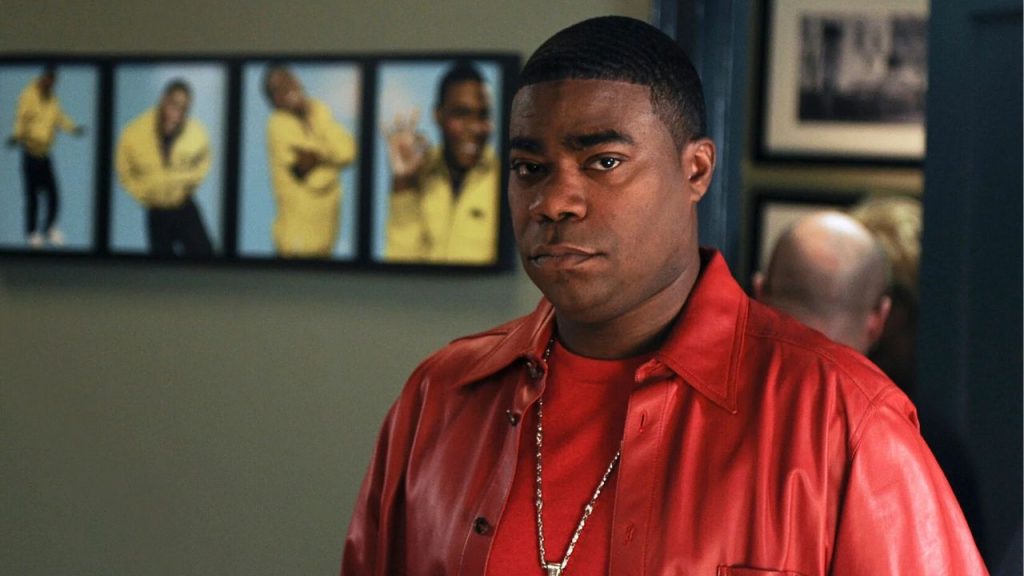 Tracy Morgan in a red jacket, looking serious in 30 Rock 