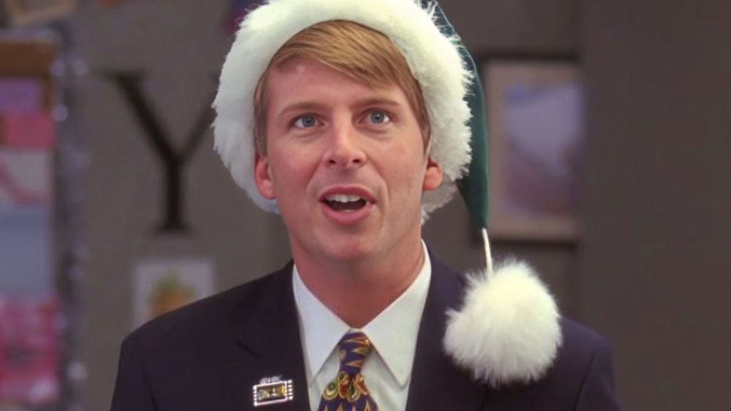 Jack McBrayer wearing a cap with mouth wide open, in 30 Rock