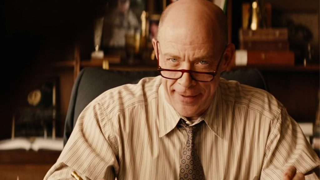 J.K. Simmons skeptically looking above his glasses in Thank You for Smoking