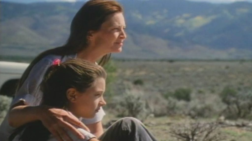 Joan Allen and Valentina de Angelis staring at a far grassland in Off the Map 