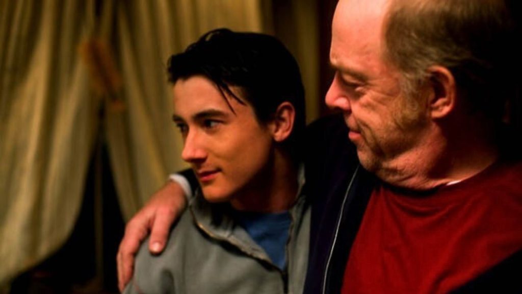 Alex Frost and J.K. Simmons hugging in The Vicious Kind