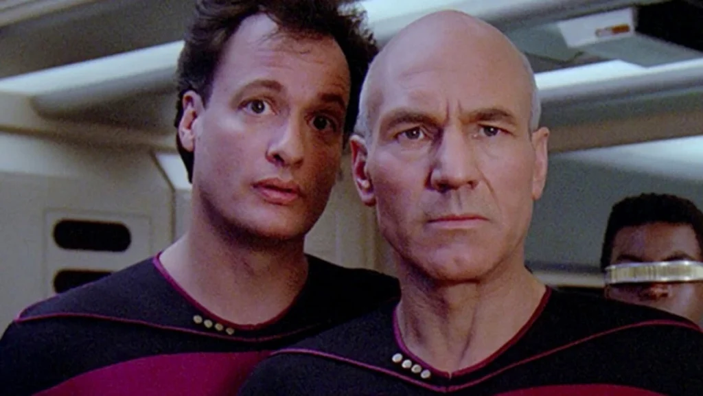 John de Lancie and Sir Patrick Stewart as Q and Captain Picard