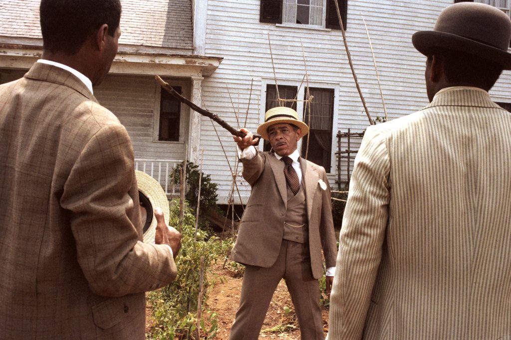 Danny Glover as Albert Johnson, Adolph Caesar as Old Mister Johnson, Willard E. Pugh as Harpo Johnson in The Color Purple