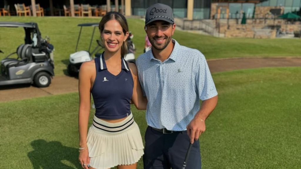 Joey Graziadei with Kelsey Anderson posing for a picture at a golf course