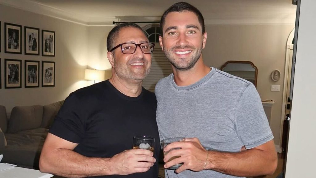 Joey Graziadei with his father, smiling while holding a drink