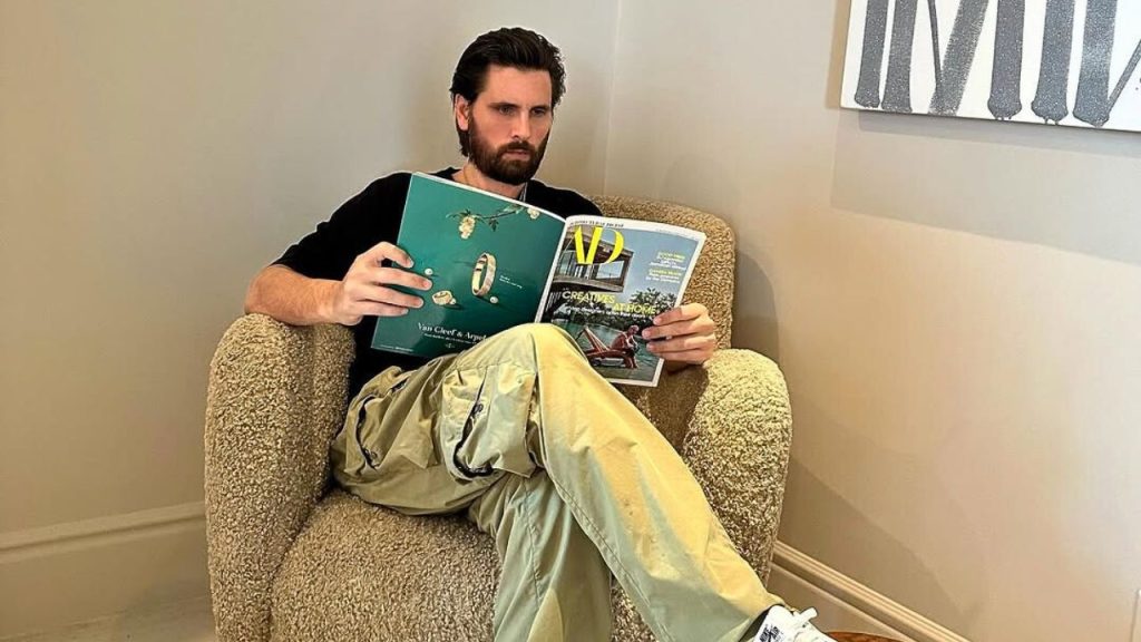 Scott Disick reading a book