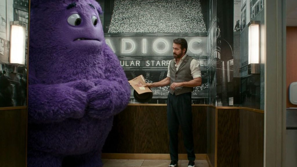 Ryan Reynolds talking to an animated character Blue in IF 