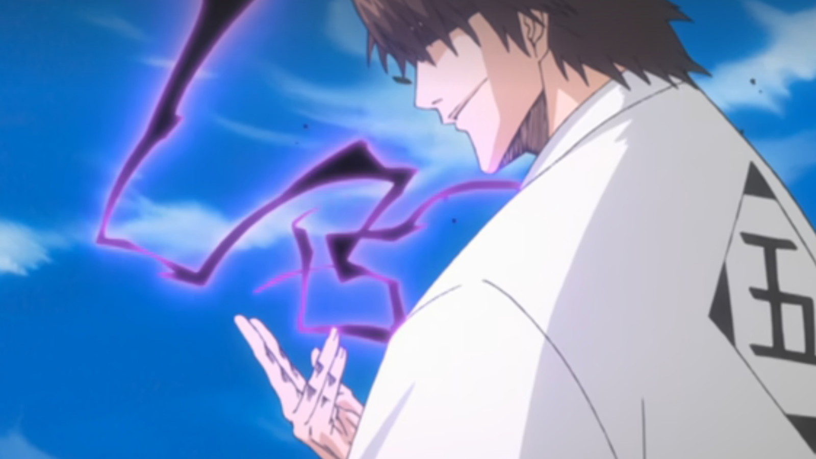 Aizen is smiling while looking at his hand in a still from Bleach