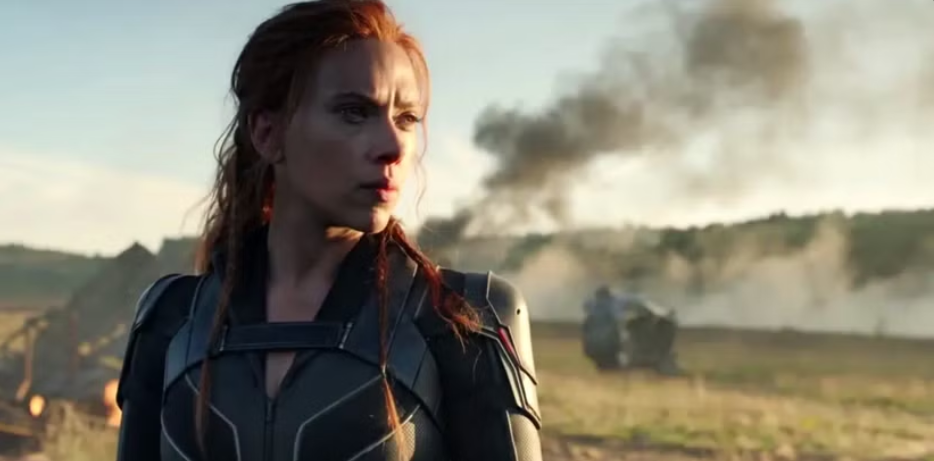 Scarlett Johansson as Natasha Romanoff in the film Black Widow is on a battlefield.