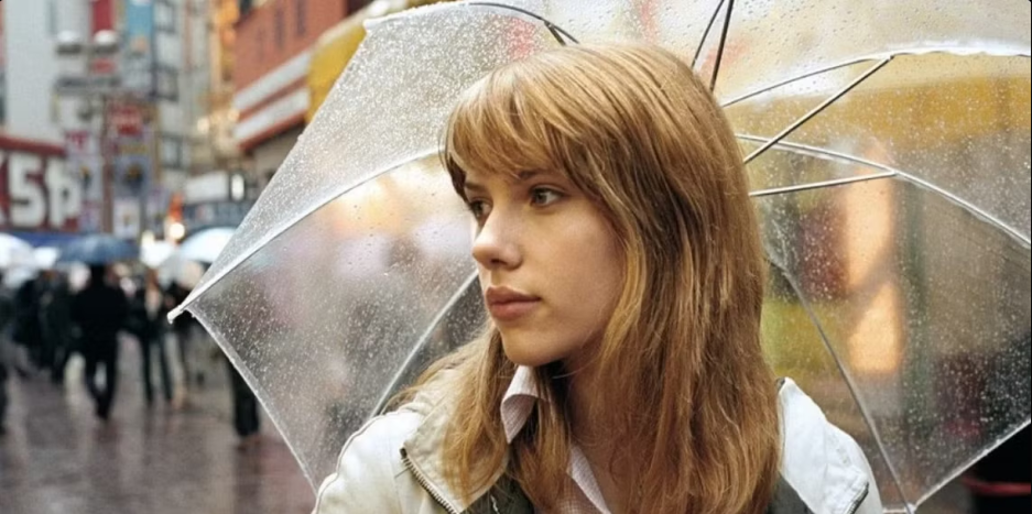 Scarlett Johansson as Charlotte in the film lost in the translation with an umbrella.