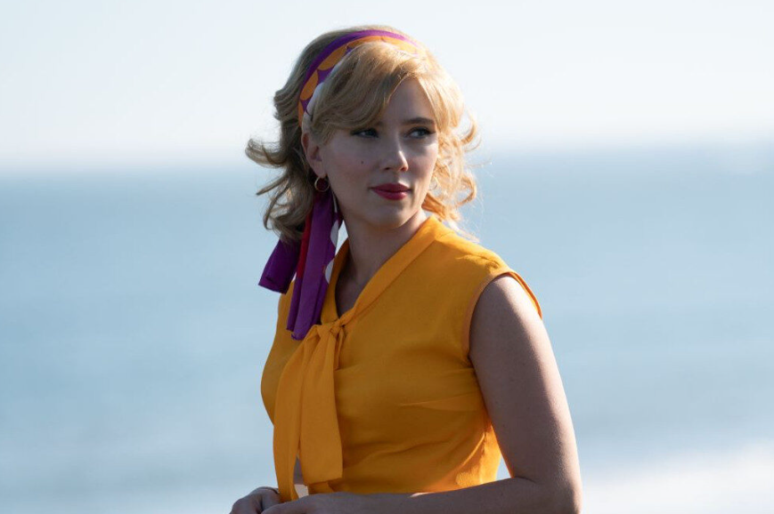 Scarlett Johansson as Kelly Jones in the film flies me to the moon in a yellow dress.