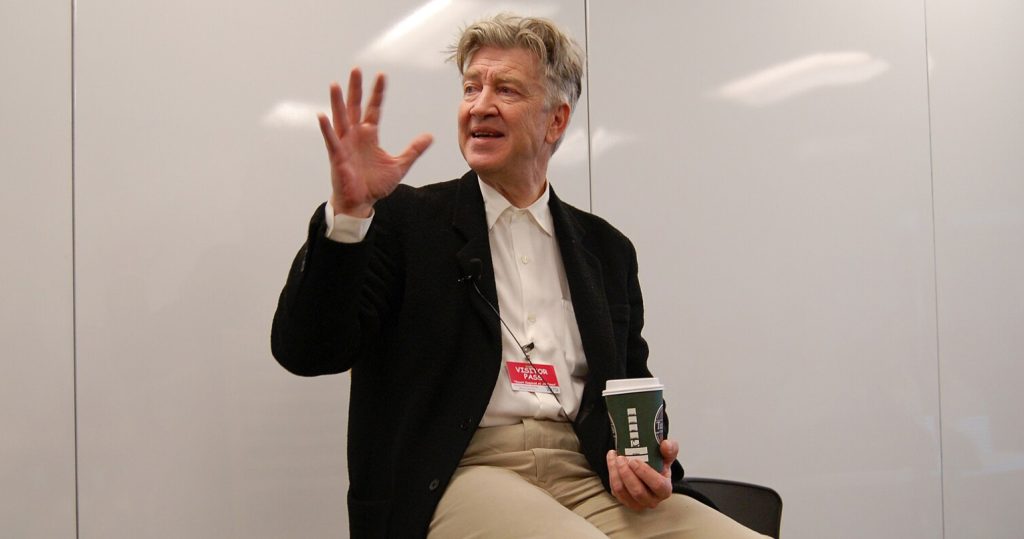 David Lynch with his large cup of coffee 