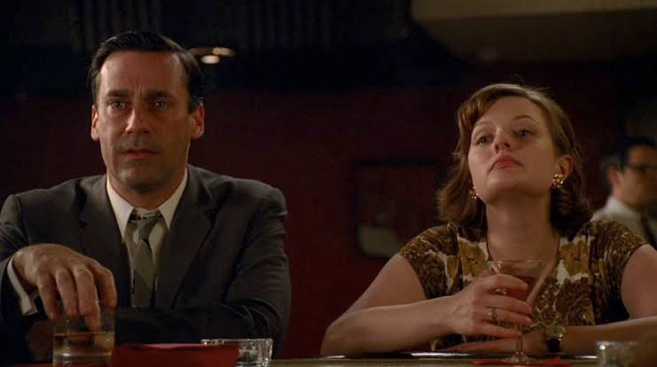 Elisabeth Moss as Peggy Olsen and Jon Hamm as Don Draper in Mad Men 