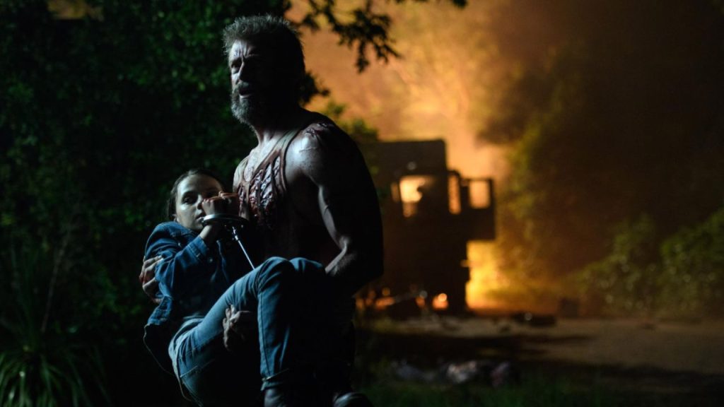 Logan carrying X-23 in Logan