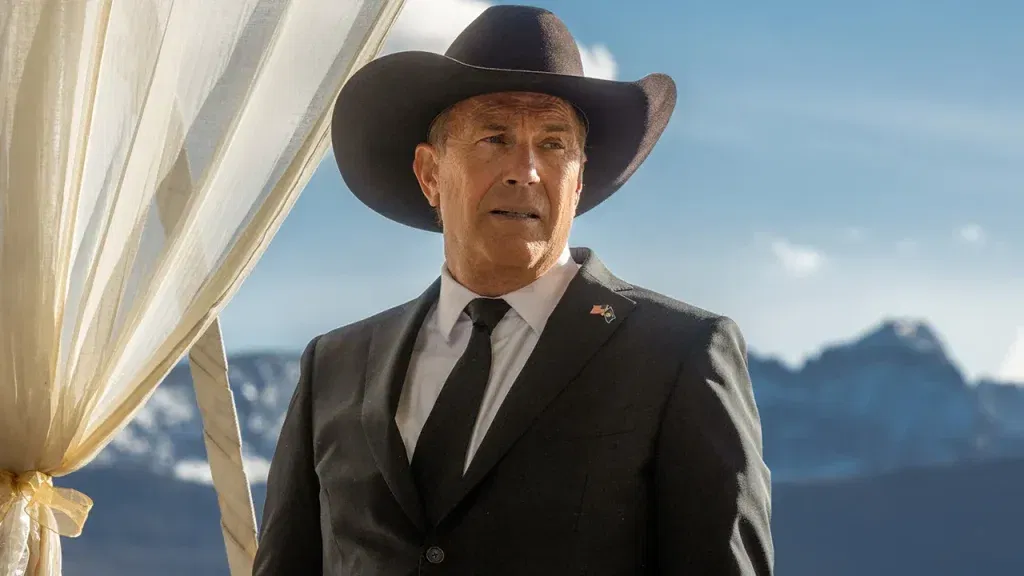 Kevin Costner as John Dutton looking to his left with a curious look in Taylor Sheridan's Yellowstone.