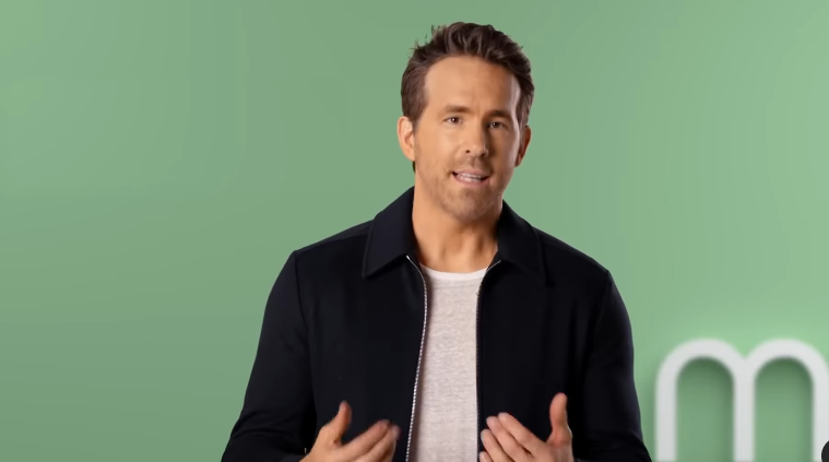Justin Baldoni vs Ryan Reynolds Net Worth Comparison: It’s Not Even Close and We All Know Why 7 The Canadian actor Ryan Reynolds in a dark jacket against a green background.