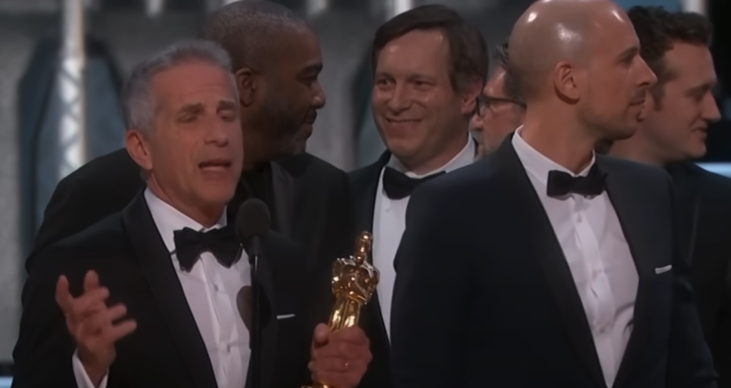 The La La Land team mid-speech, accepting the Best Picture Oscar