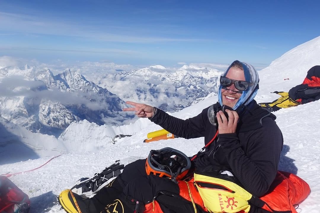 Mike Posner at the summit of Mount Everest.