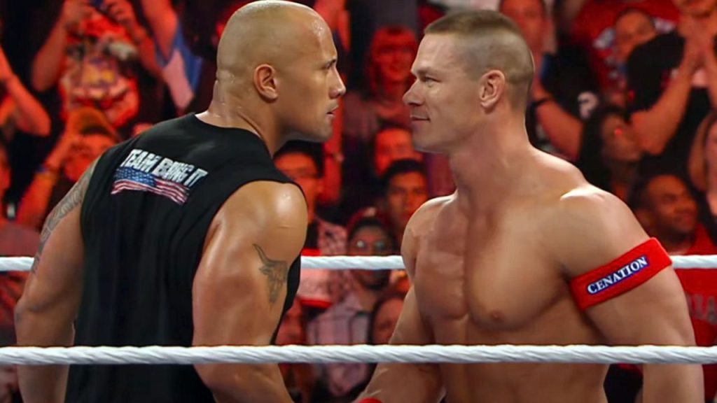 Dwayne 'The Rock' Johnson and John Cena facing off in the WWE ring