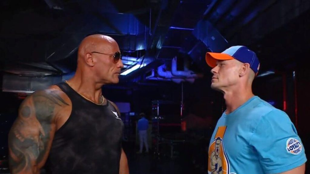 Dwayne Johnson and John Cena looking at each other at WWE backstage