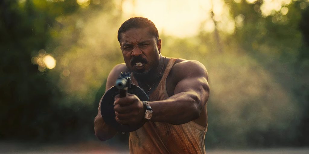 Michael B Jordan firing a SMG