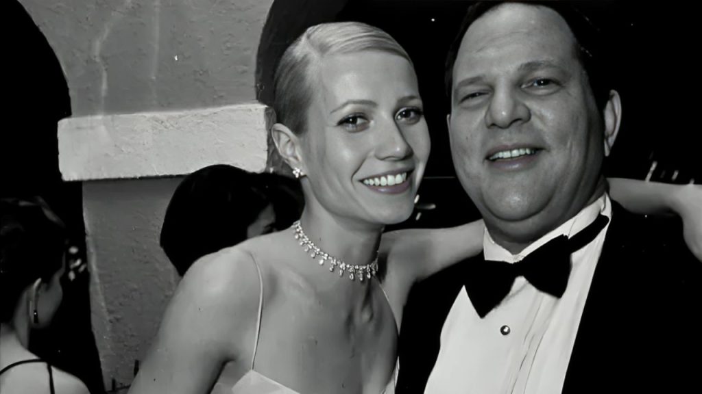 Gwyneth Paltrow putting her arm over the shoulder of Harvey Weinstein