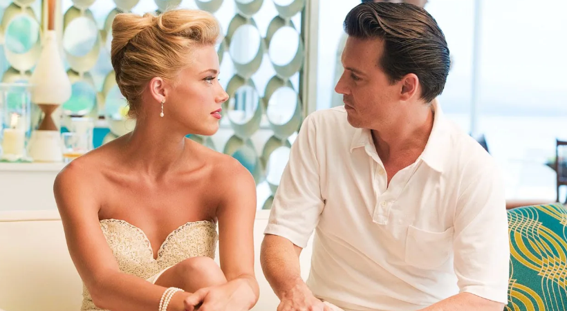 Johnny Depp as Paul Kemp and Amber Heard as Chenault in the movie The Rum Diary.