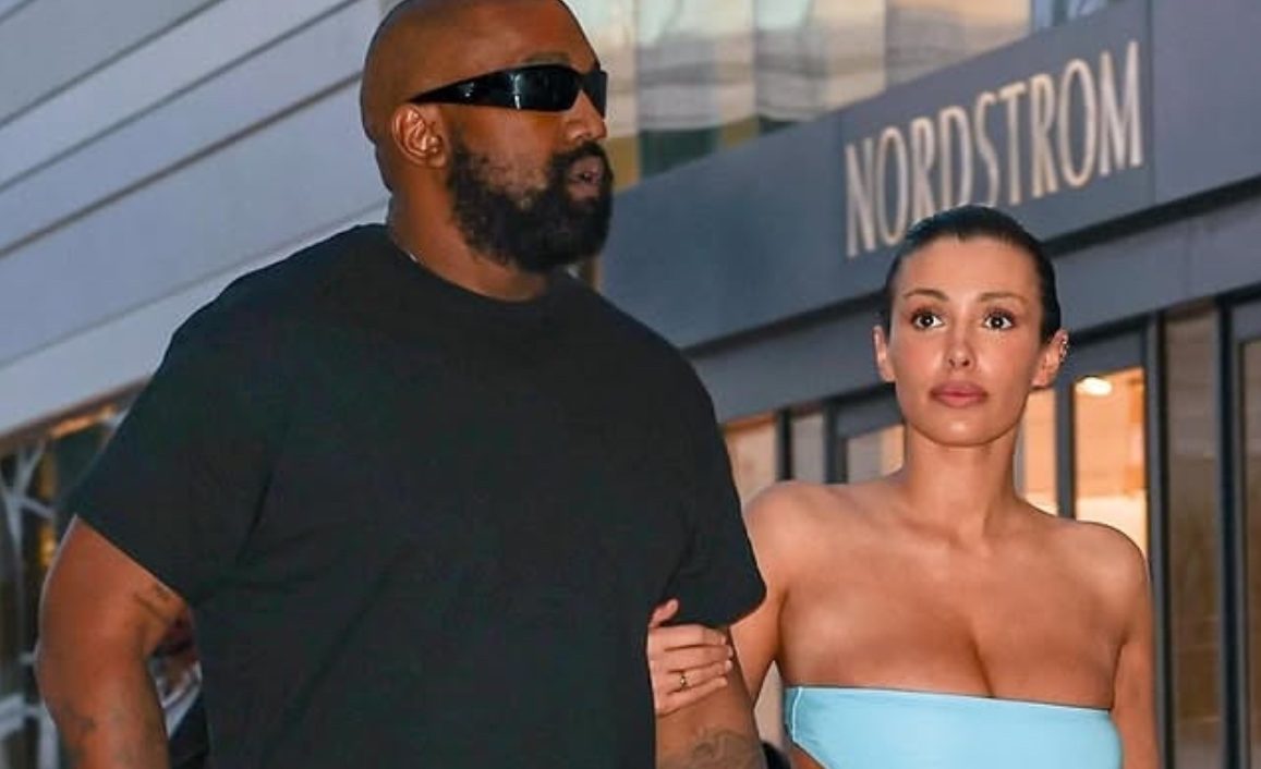 Kanye West with his second wife Bianca Censori walking through the streets. 