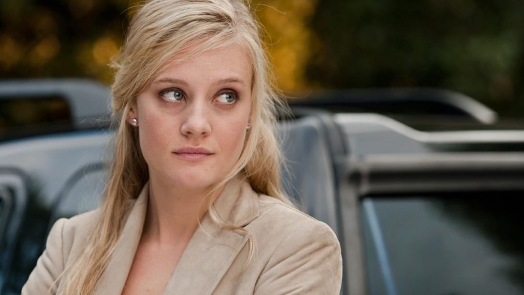 Romola Garai looking at someone sideways in One Day 