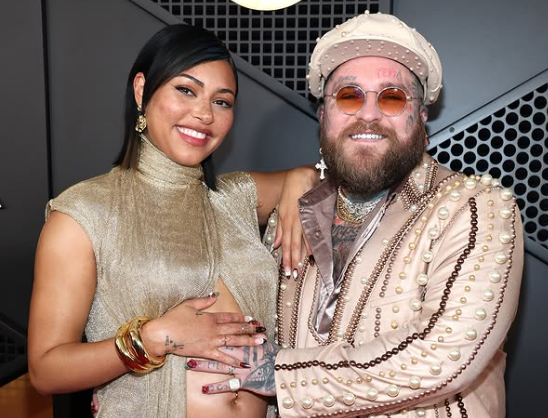 A pregnant Raiche Wright with her husband Teddy Swims wearing pearl-studded suit at Grammy 2025.