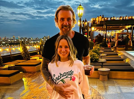 Dax Shepard with his wife Kristen Bel at a restaurant.