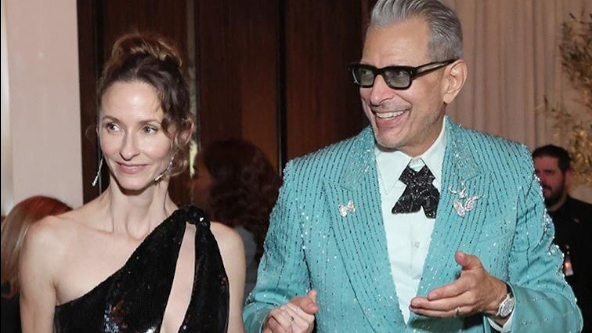 Jeff Goldblum in a blue suit with his wife Emilie Livingston wearing a black dress at the Golden Globe 2025.