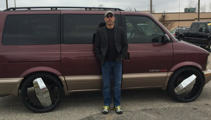 Comedian Jerry Seinfeld with his Chevrolet Astro