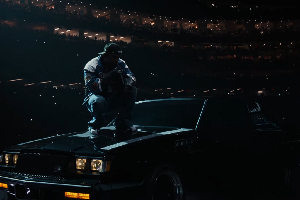 Kendrick Lamar on top of a black GNX, the same model which was used in his latest album.