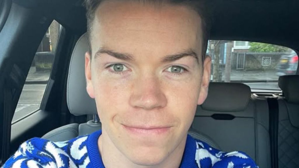 Will Poulter inside a car