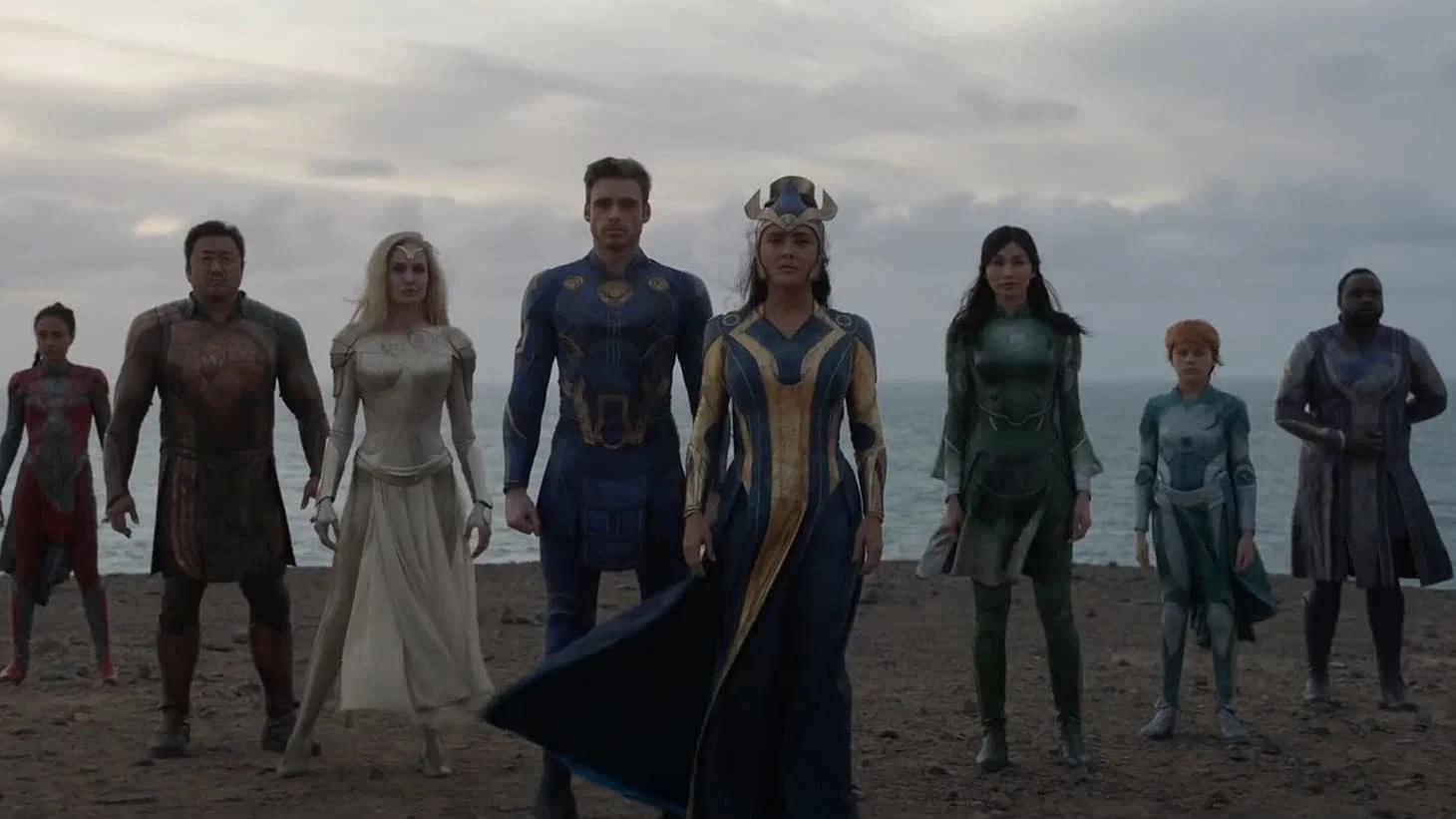 The eternals standing on a beach