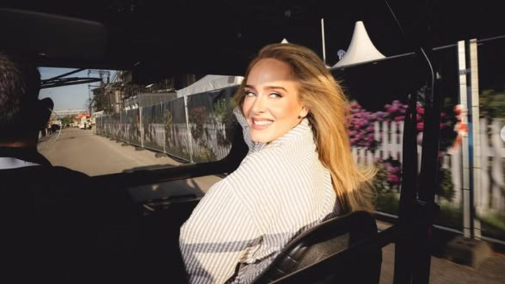 Adele riding a car