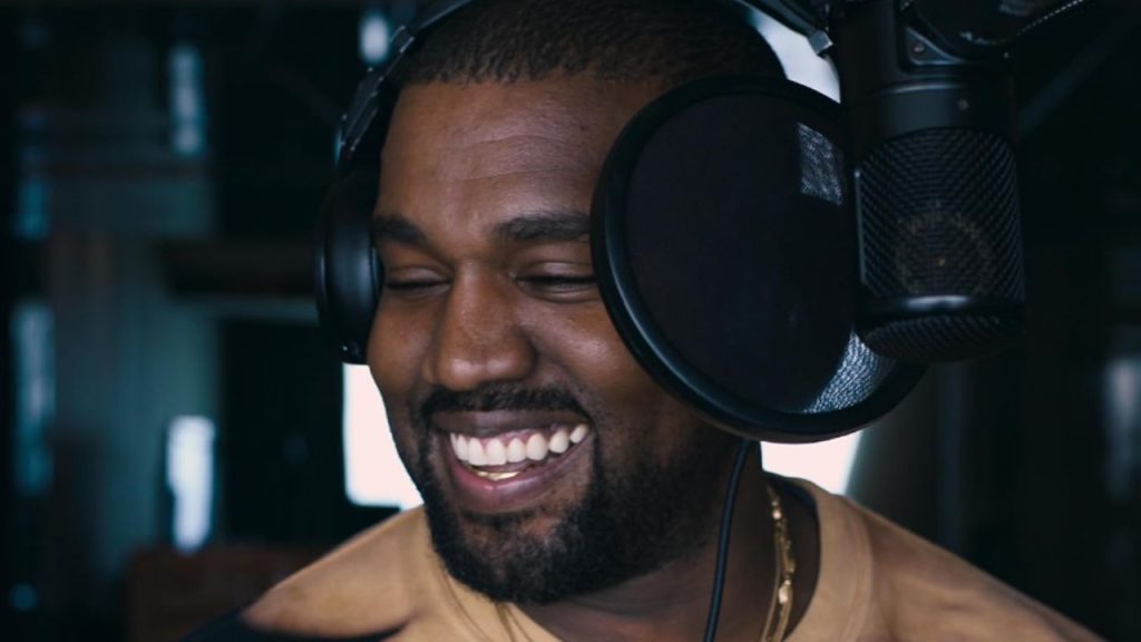 Kanye West smiling in a still from Jeen-Yuhs: A Kanye Trilogy 