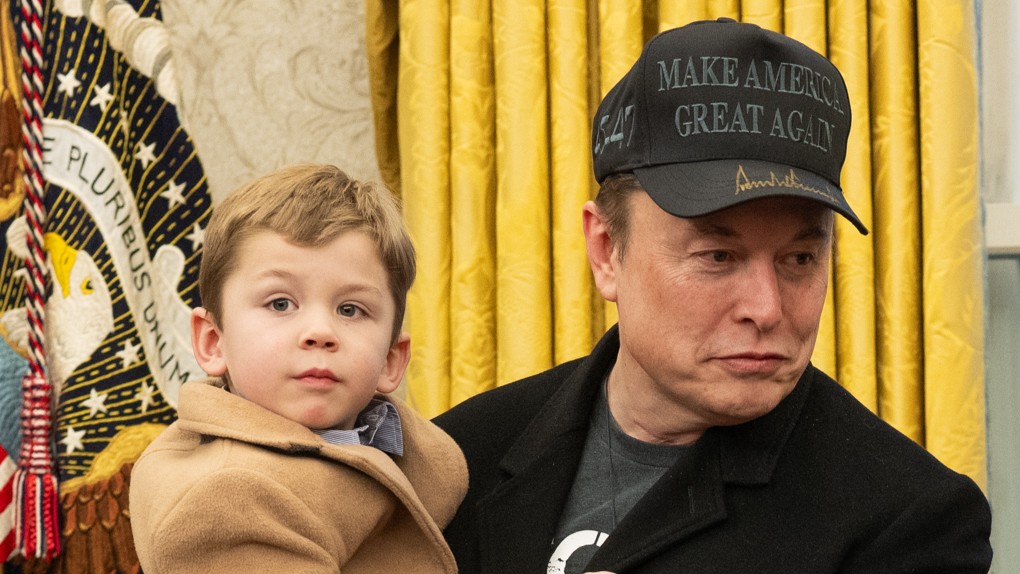 Elon Musk with X Æ A-Xii in the Oval Office setting, with gold curtains and the presidential seal visible in the background. Musk is wearing a 'MAKE AMERICA GREAT AGAIN' cap and dark clothing, while X Æ A-Xii is wearing a tan coat.