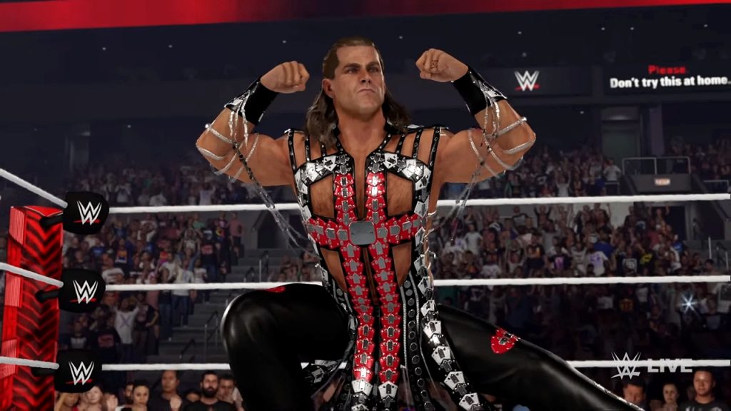 Gameplay screenshot from WWE 2K24 featuring Shawn Michaels flexing his biceps in the ring.