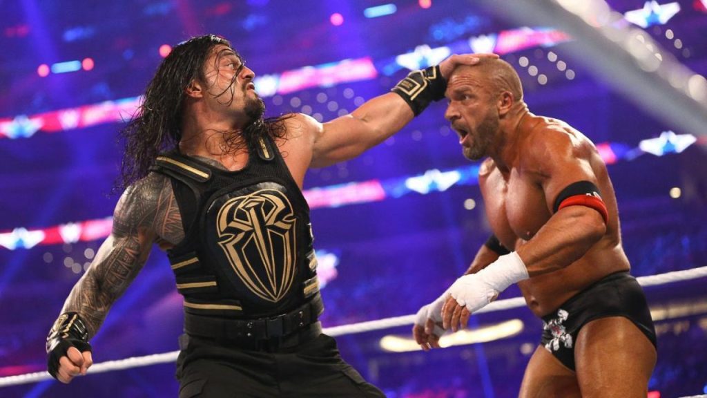 Why Did Roman Reigns and Triple H Always Have Wet Hair: Former WWE Star May Have an Answer 1 Roman Reigns and Triple H in the ring