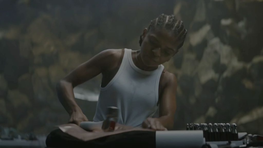 Dominique Thorne hammering her Ironheart suit in Black Panther: Wakanda Forever